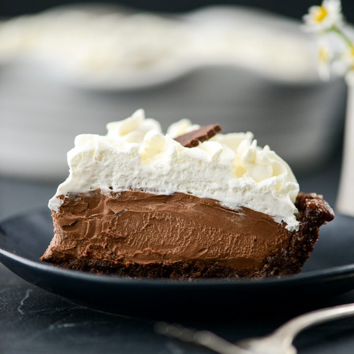 side view of a slice of vegan chocolate pie on a plate