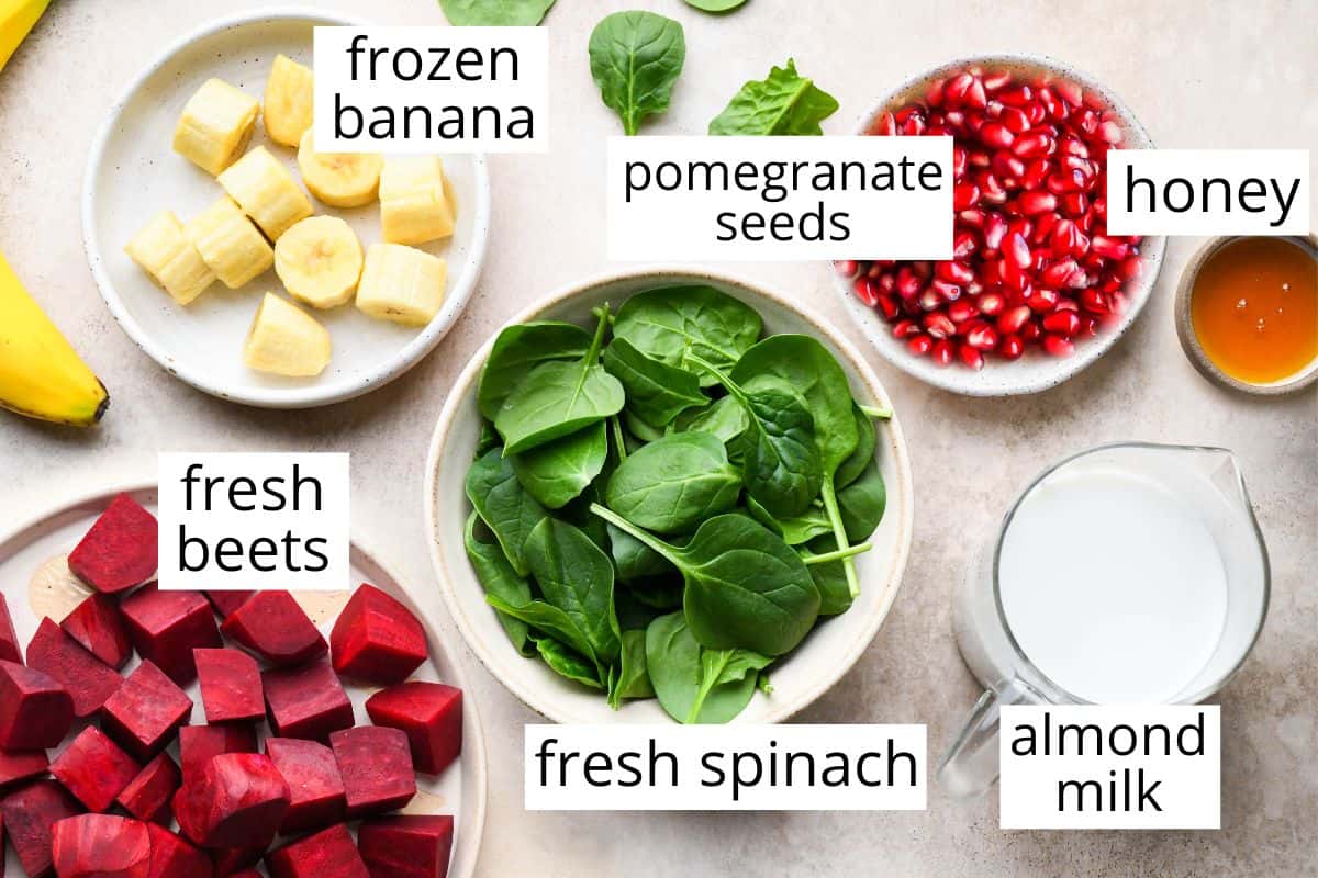 overhead photo of the labeled ingredients in this beet & pomegranate smoothie recipe