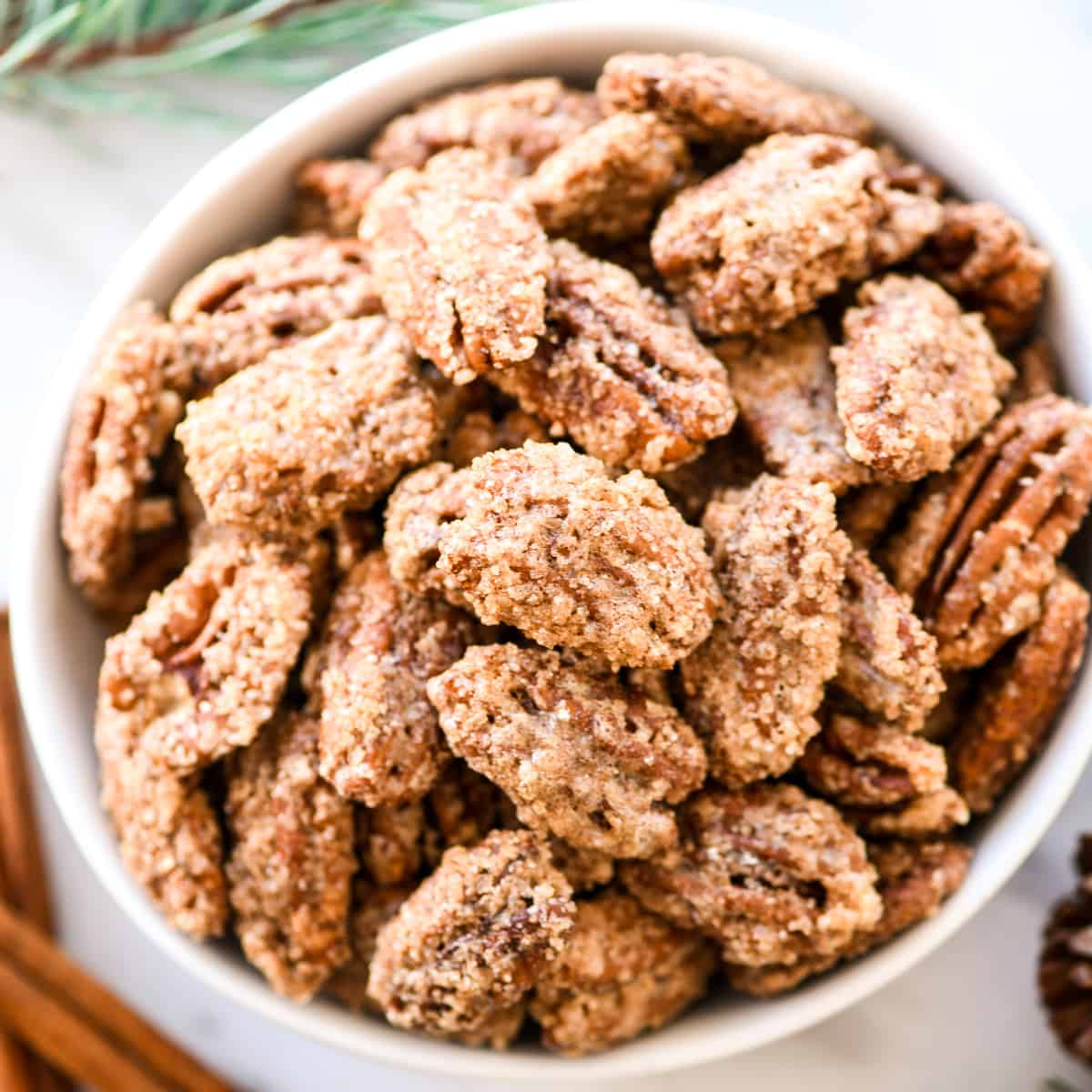 Overhead view of a bowl of homemade Cinnamon Sugar Pecans 