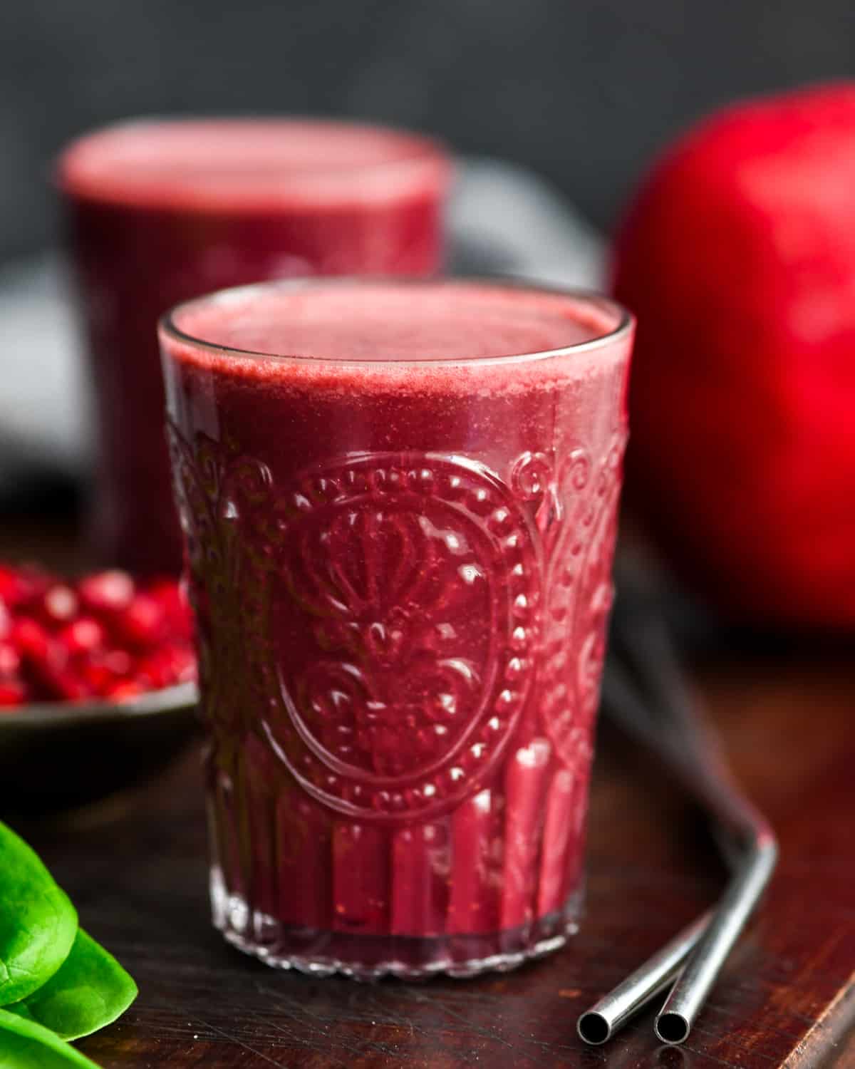 two glasses  filled with Beet & Pomegranate Smoothie 