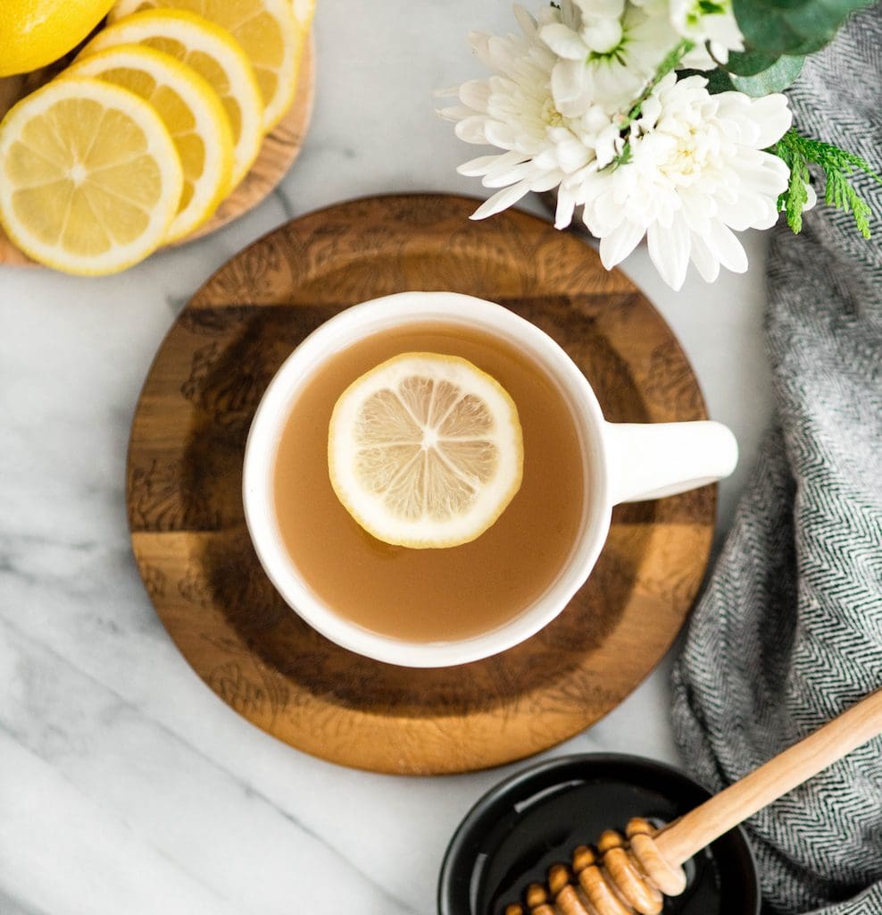 Overhead view of Immune Boosting Tea Recipe in a mug with a lemon slice in it 