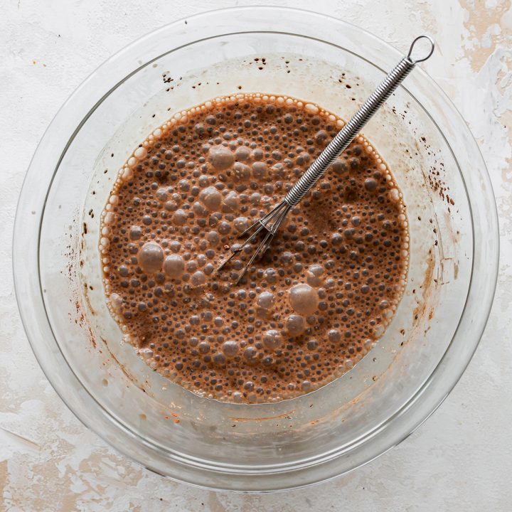 photo showing How to Make Chocolate Peanut Butter Chia Pudding in a bowl with a whisk