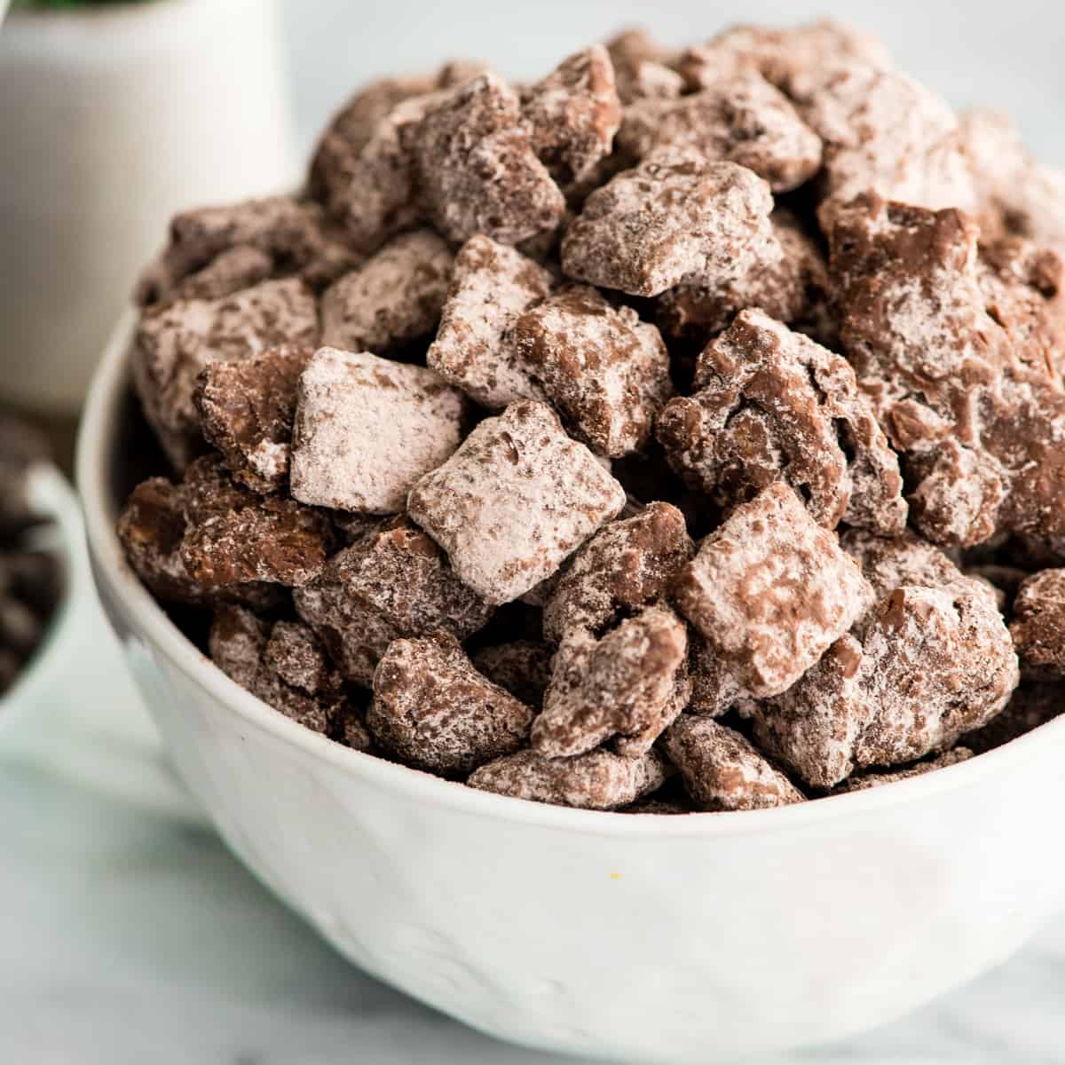 Side view of a bowl of Dark Chocolate Puppy Chow 