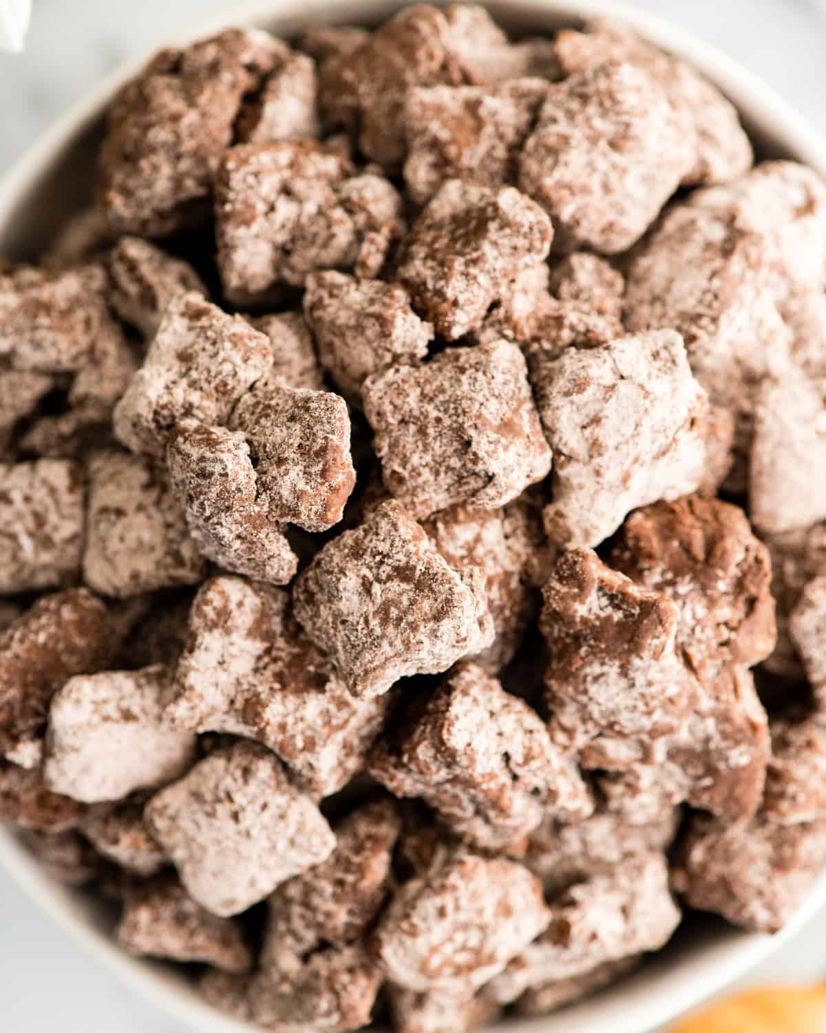 up close overhead view of Dark Chocolate Puppy Chow in  a bowl