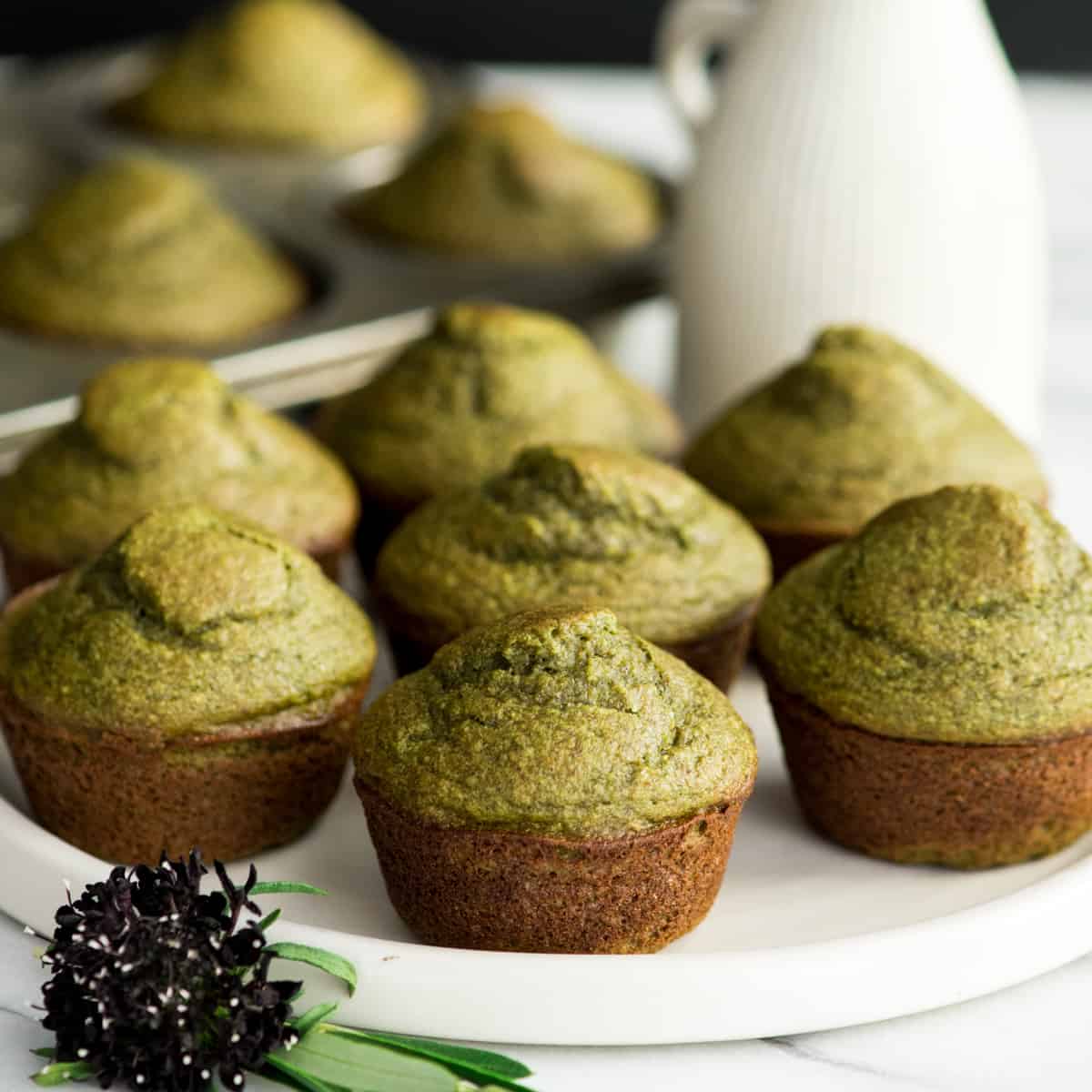 7 Banana Spinach Muffins on a plate 