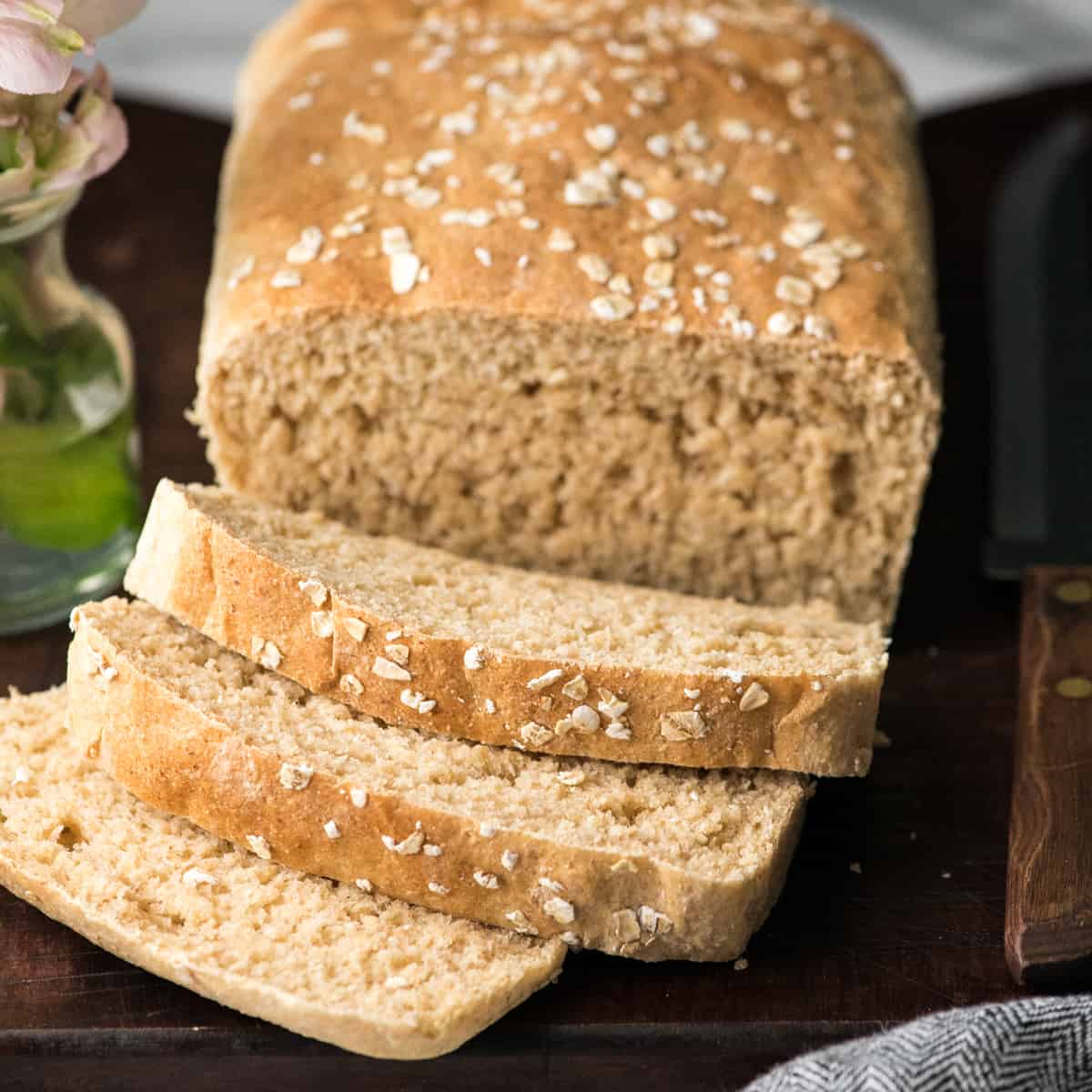 a loaf of Honey Wheat Bread with 3 slices cut out of it.
