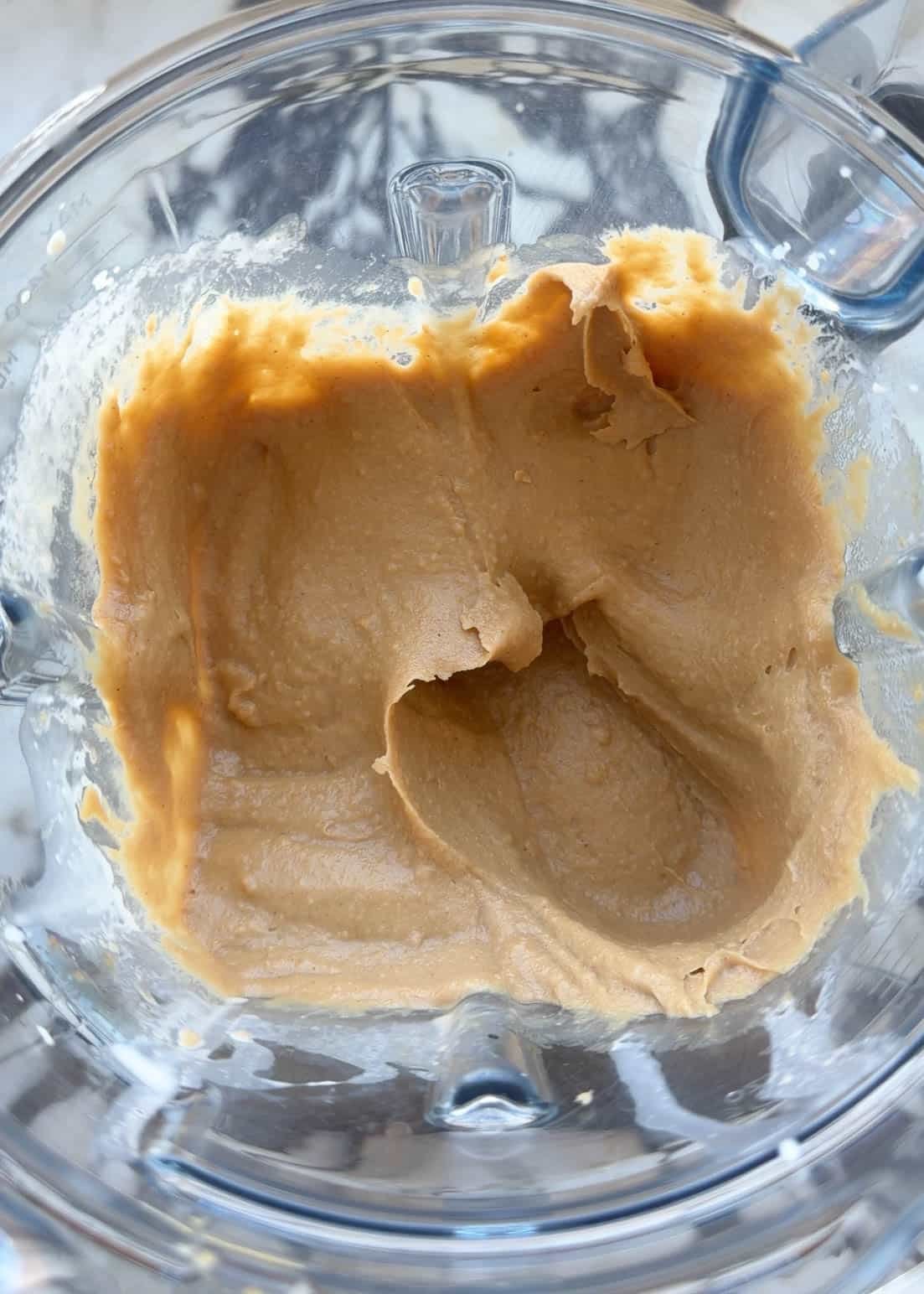 chickpea blondie batter after blending in a blending container.