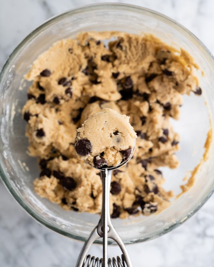 photo showing How to Make Chocolate Chip Cookies - portioning cookie dough with a cookie scoop
