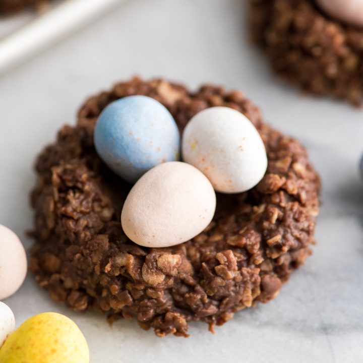 Close up shot of one easter nest cookie with three eggs on it. 