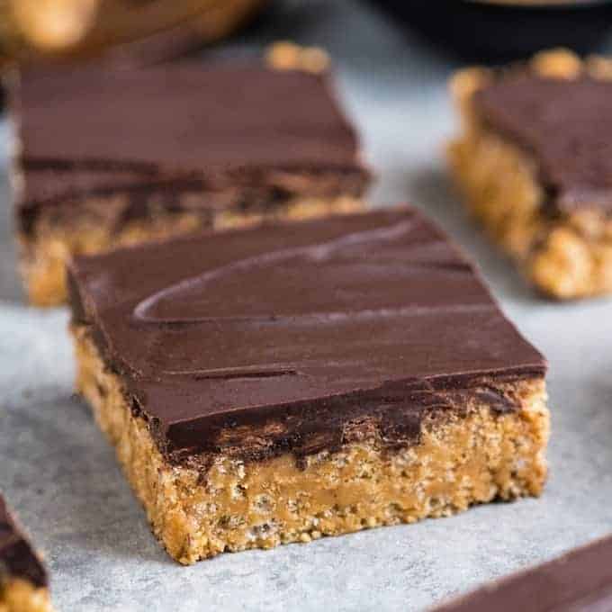 front view of a healthy peanut butter rice crispy treat with four others in the background