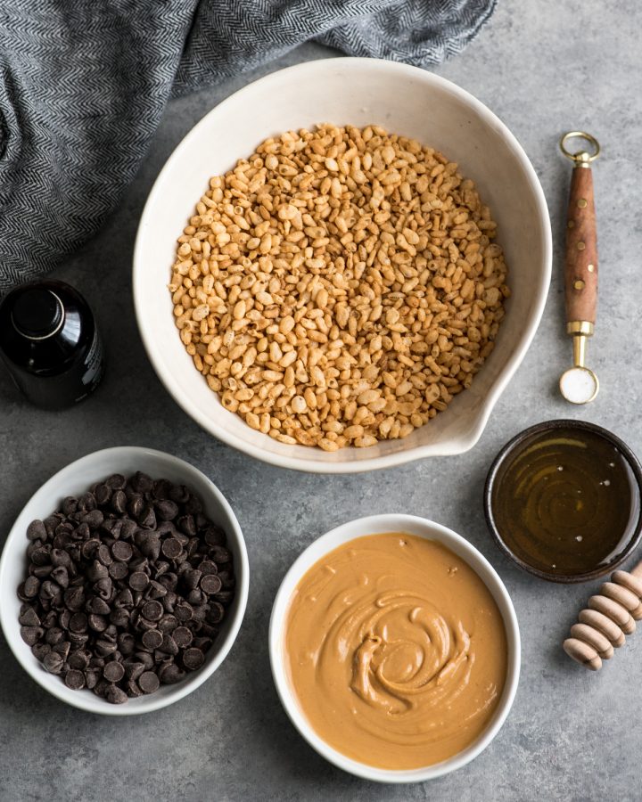 Overhead view of the ingredients laid out ready to make healthy peanut butter rice krispe treats. 