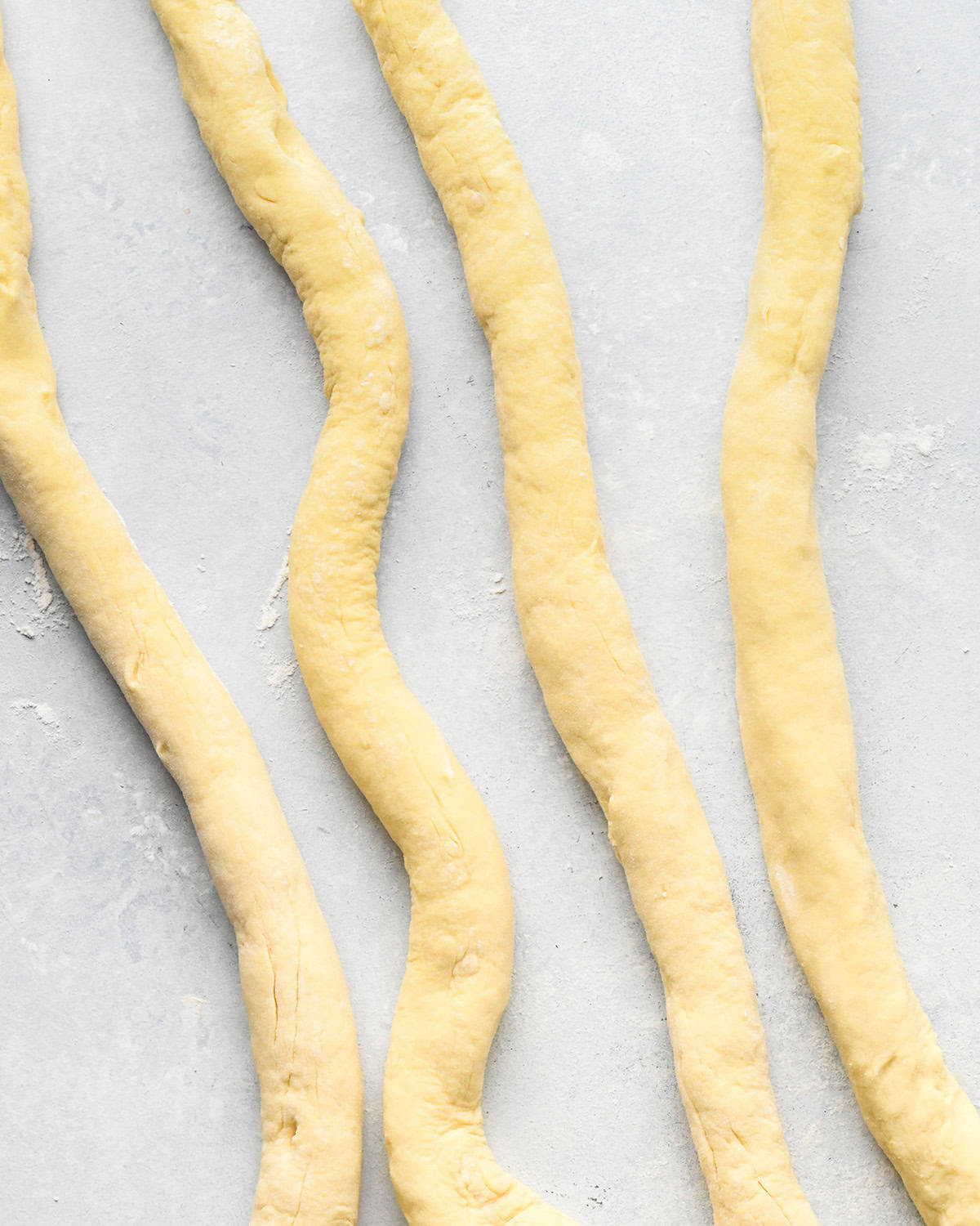 How to Make Potato Gnocchi - dough rolled into 4 "ropes"