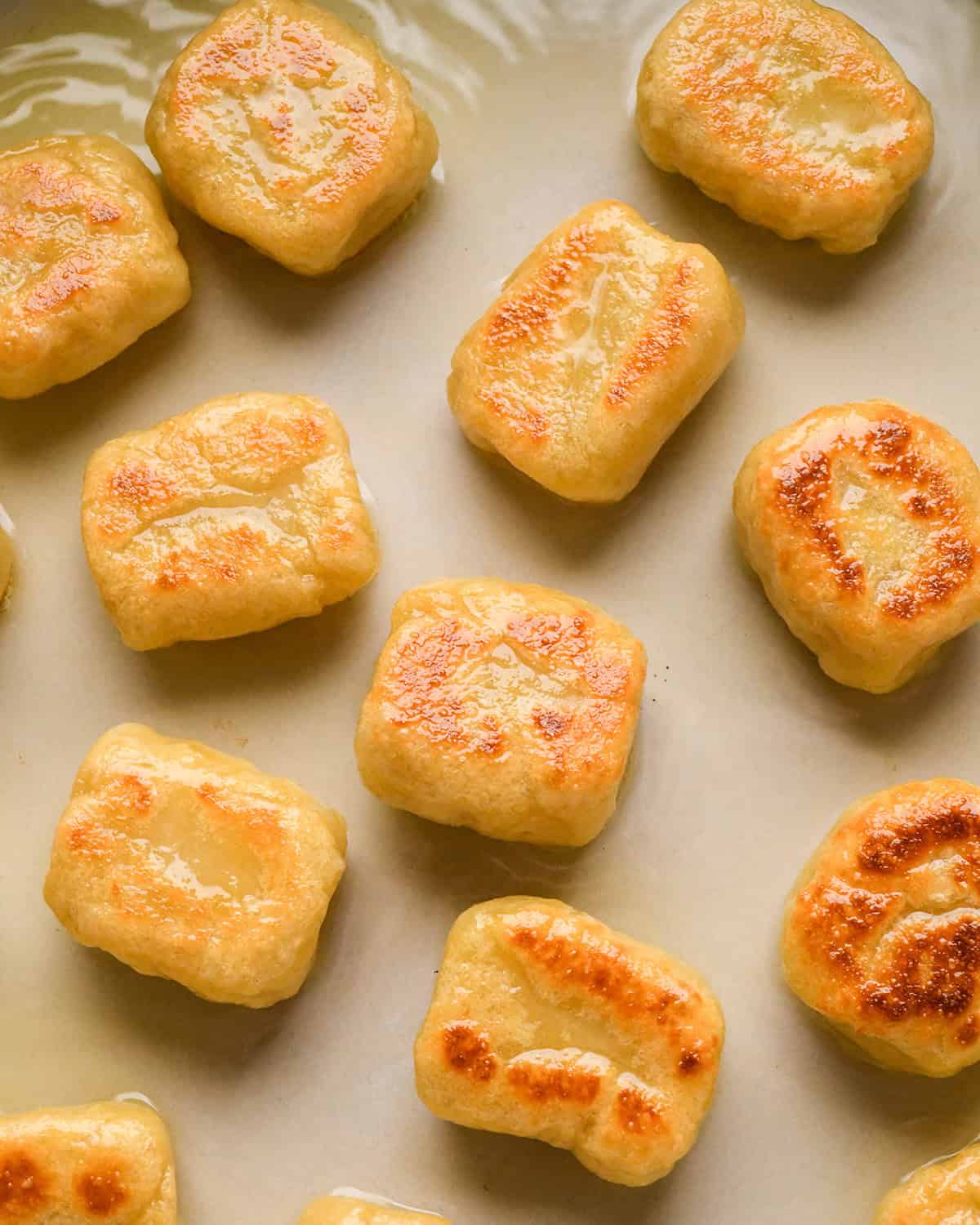 browned potato gnocchi in a pan