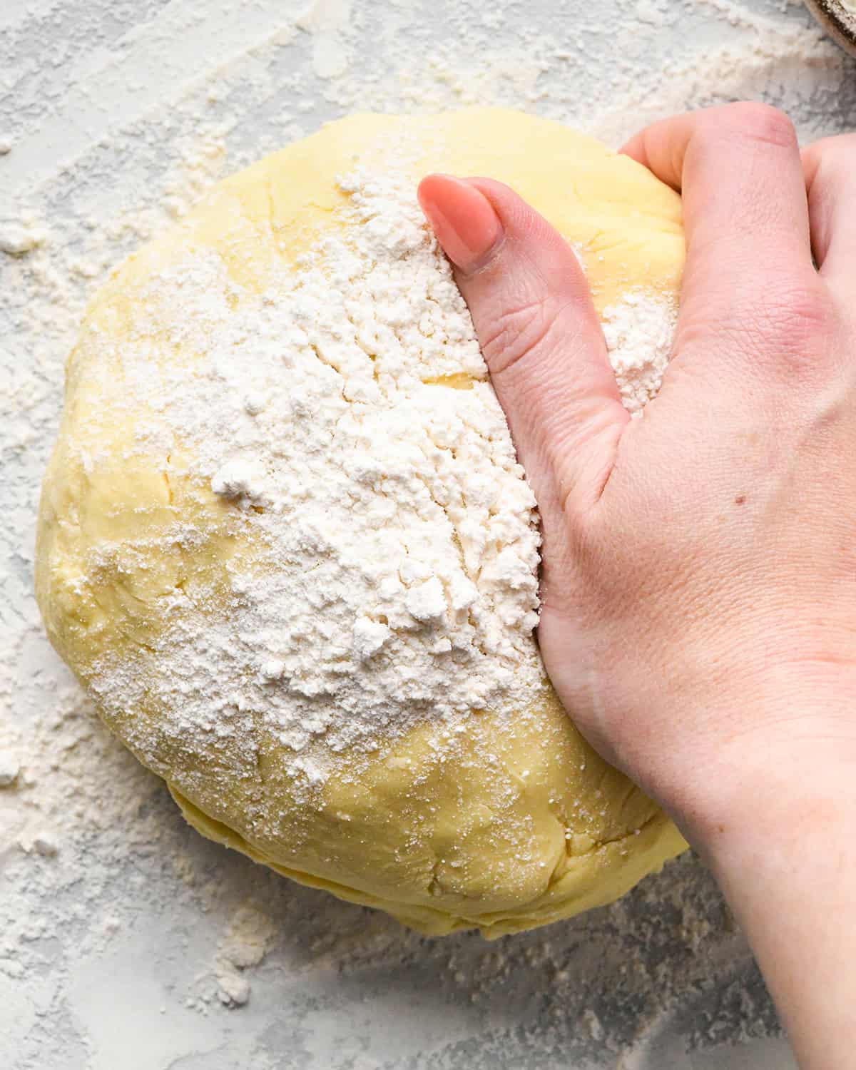 How to Make Potato Gnocchi - adding flour to dough and kneading