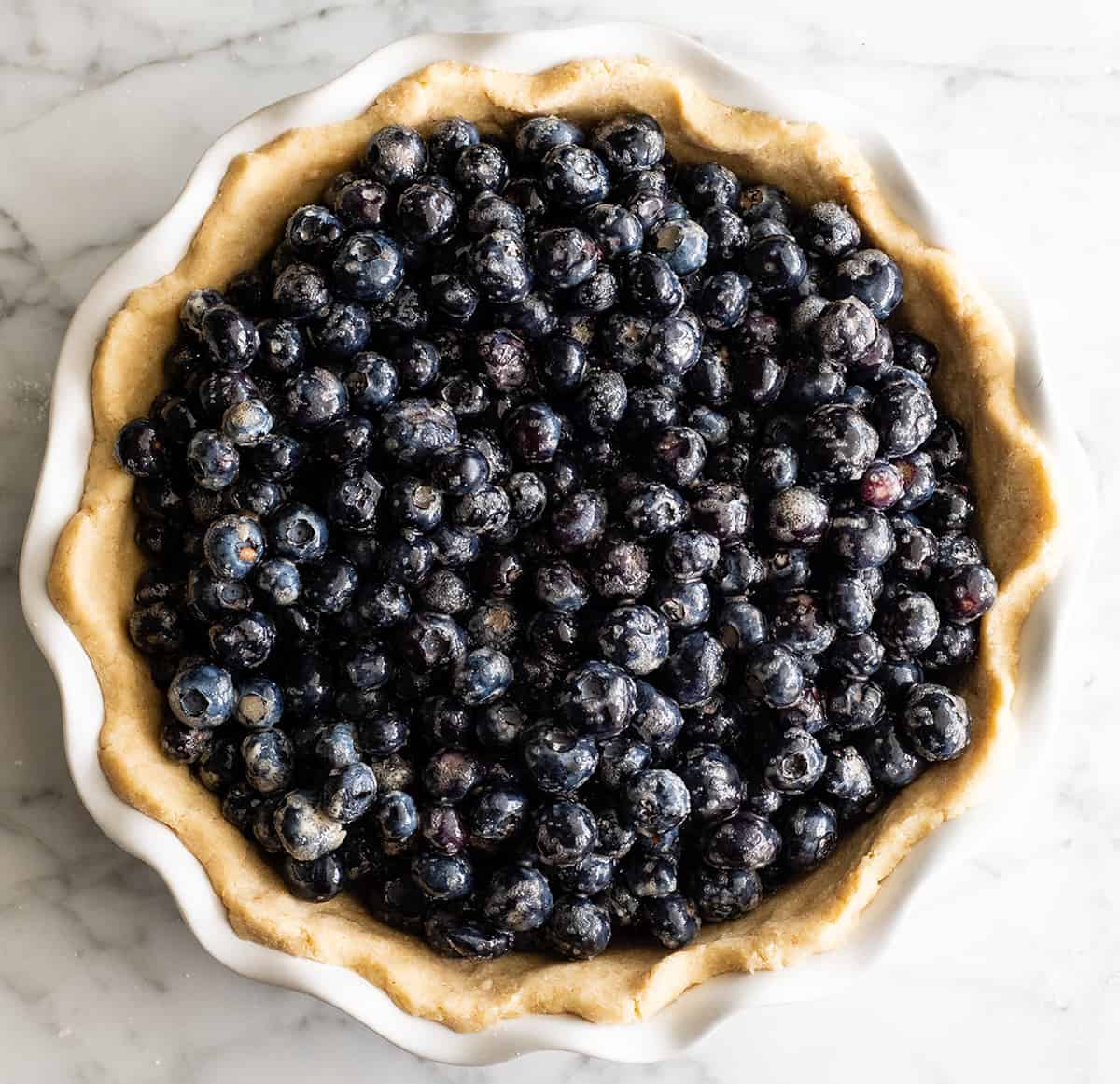 overhead photo showing how to make blueberry pie