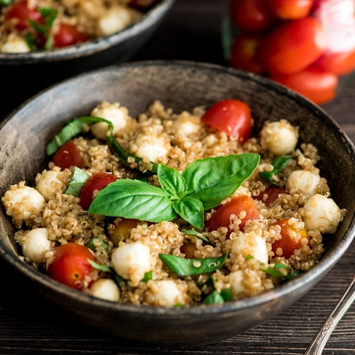 Front view of two bowls of Balsamic Caprese Quinoa Salad 