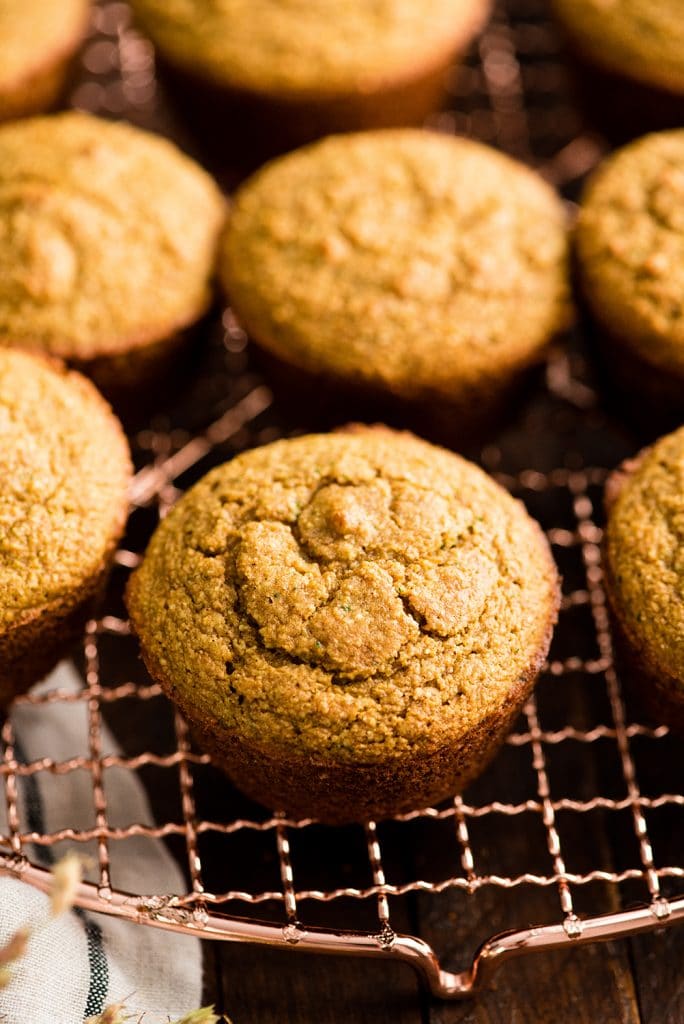 up close front view of Carrot Zucchini Muffins on a cooling rack