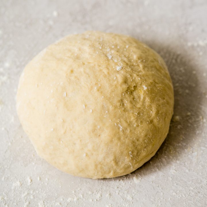 overhead photo of a ball of homemade pizza dough