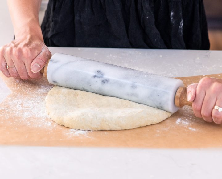photo showing How to Make Pizza Dough - rolling out the dough