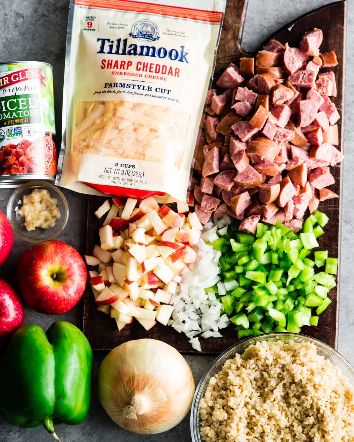 overhead view of the ingredients in this Baked Quinoa Casserole recipe on a wood cutting board