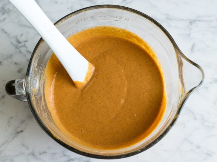 photo of dairy free pumpkin pie filling in a glass batter bowl