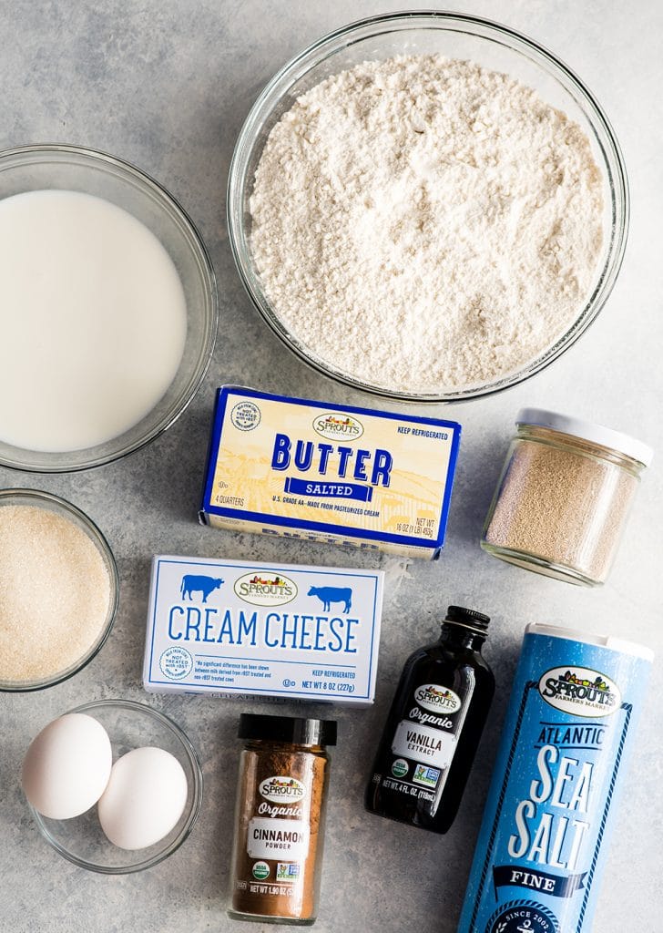 This is the Best Homemade Cinnamon Rolls Recipe EVER! These gooey cinnamon rolls are even better than Cinnabon cinnamon rolls, and are topped with the best cream cheese frosting! They're easy to make and can be prepared the day before and left to rise overnight in the refrigerator. #cinnamonrolls #breakfast #cinnabon #bestcinnamonrolls #baking overhead view of the ingredients in this Best Cinnamon Rolls Recipe (Better than Cinnabon)