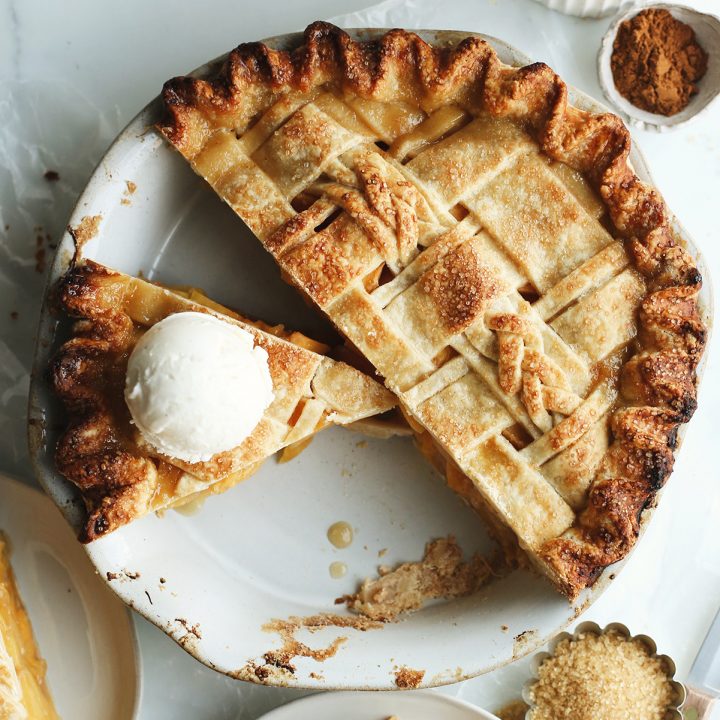 overhead view of a baked Butter Pie Crust with a slice cut out and ice cream on top