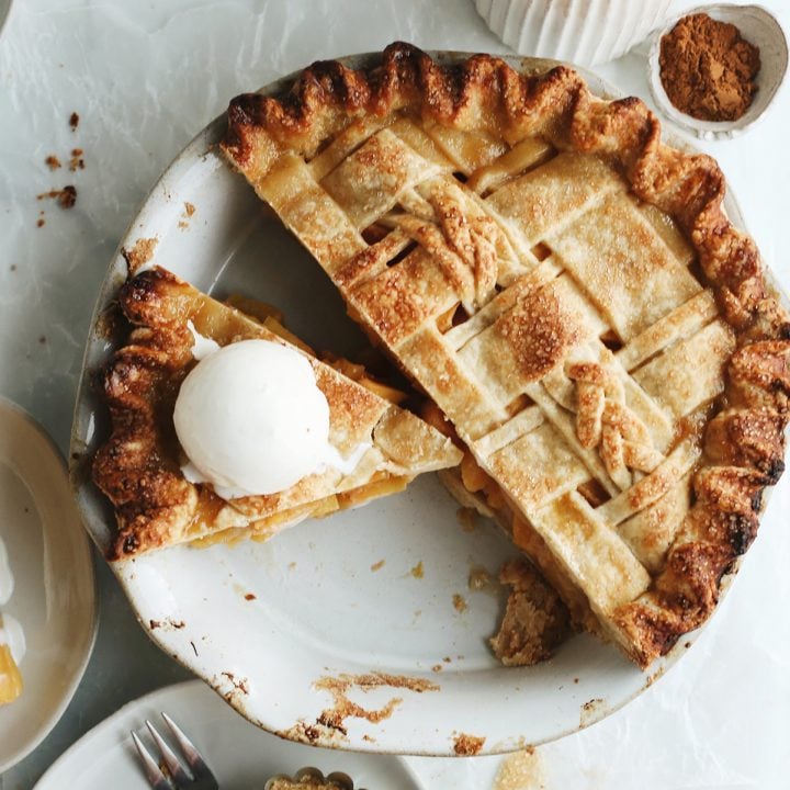 overhead view of a pie with a Butter Pie Crust and a slice cut out with ice cream on top