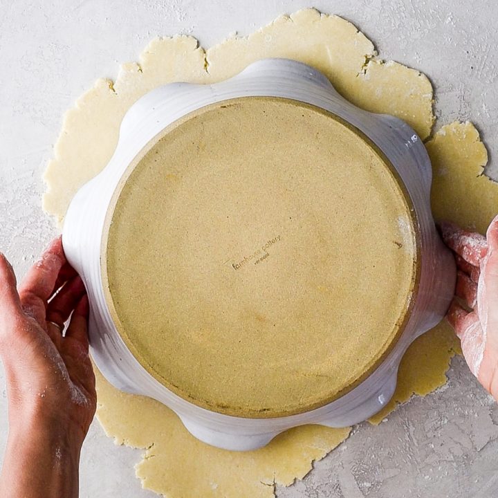 photo showing how to measure the butter pie crust dough with the pie plate