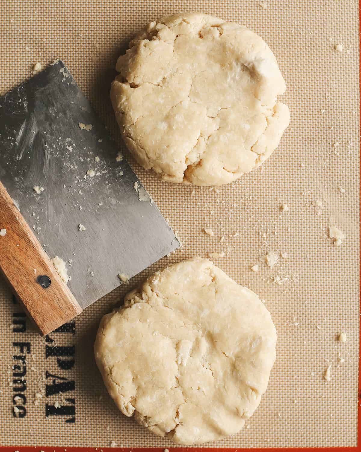 overhead photo showing How to Make Pie Crust - forming dough into two discs