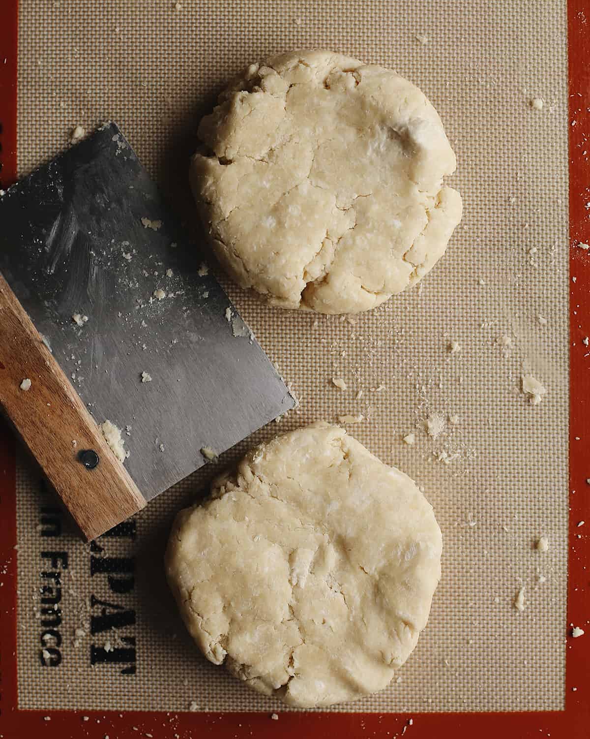 overhead photo showing How to Make Pie Crust - forming dough into two discs