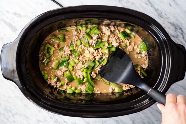 Overhead view of Thai Slow-Cooker Ground Turkey after veggies and turkey have been added to the sauce in the crockpot before cooking