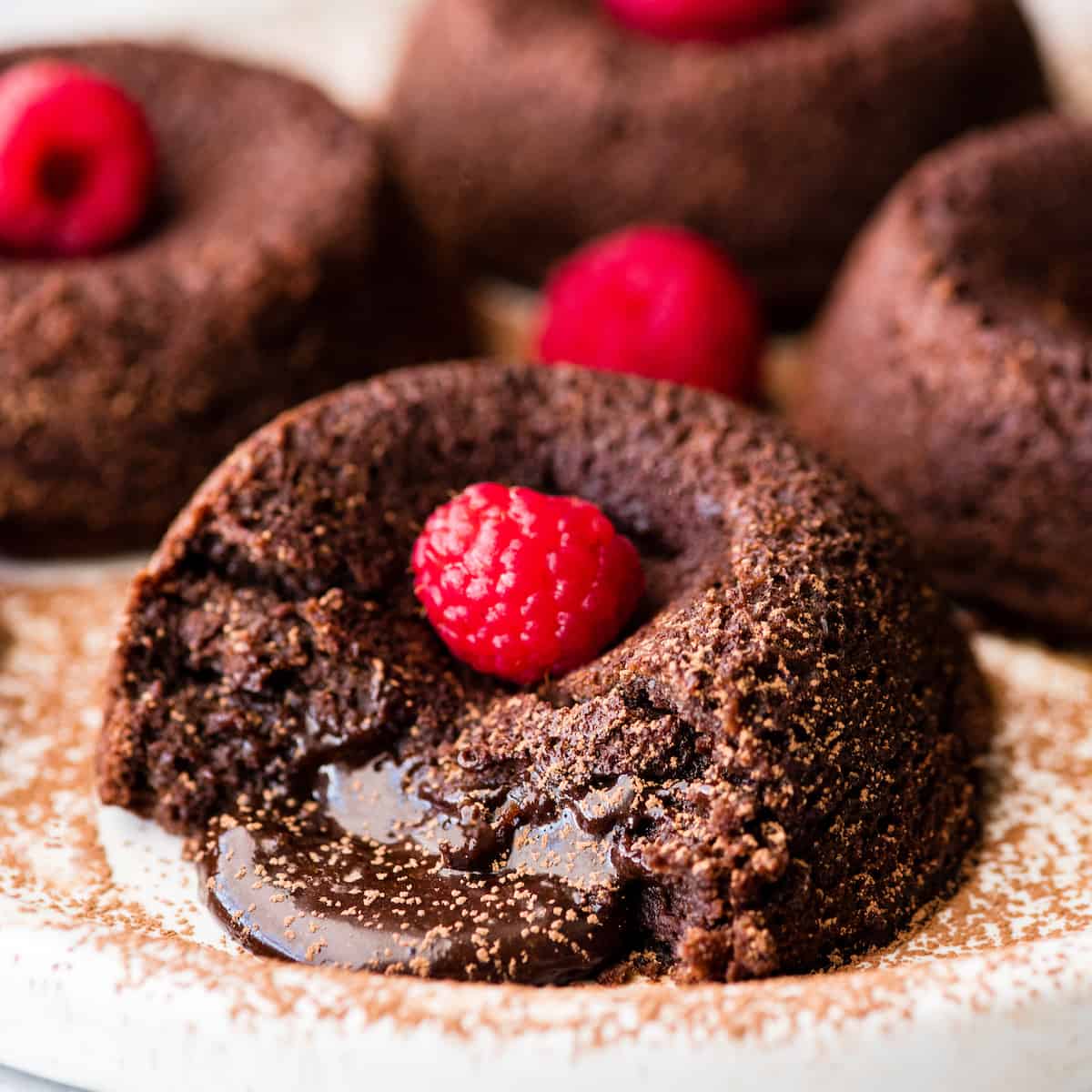 Front view of a Molten Chocolate Lava Cake oozing chocolate filling