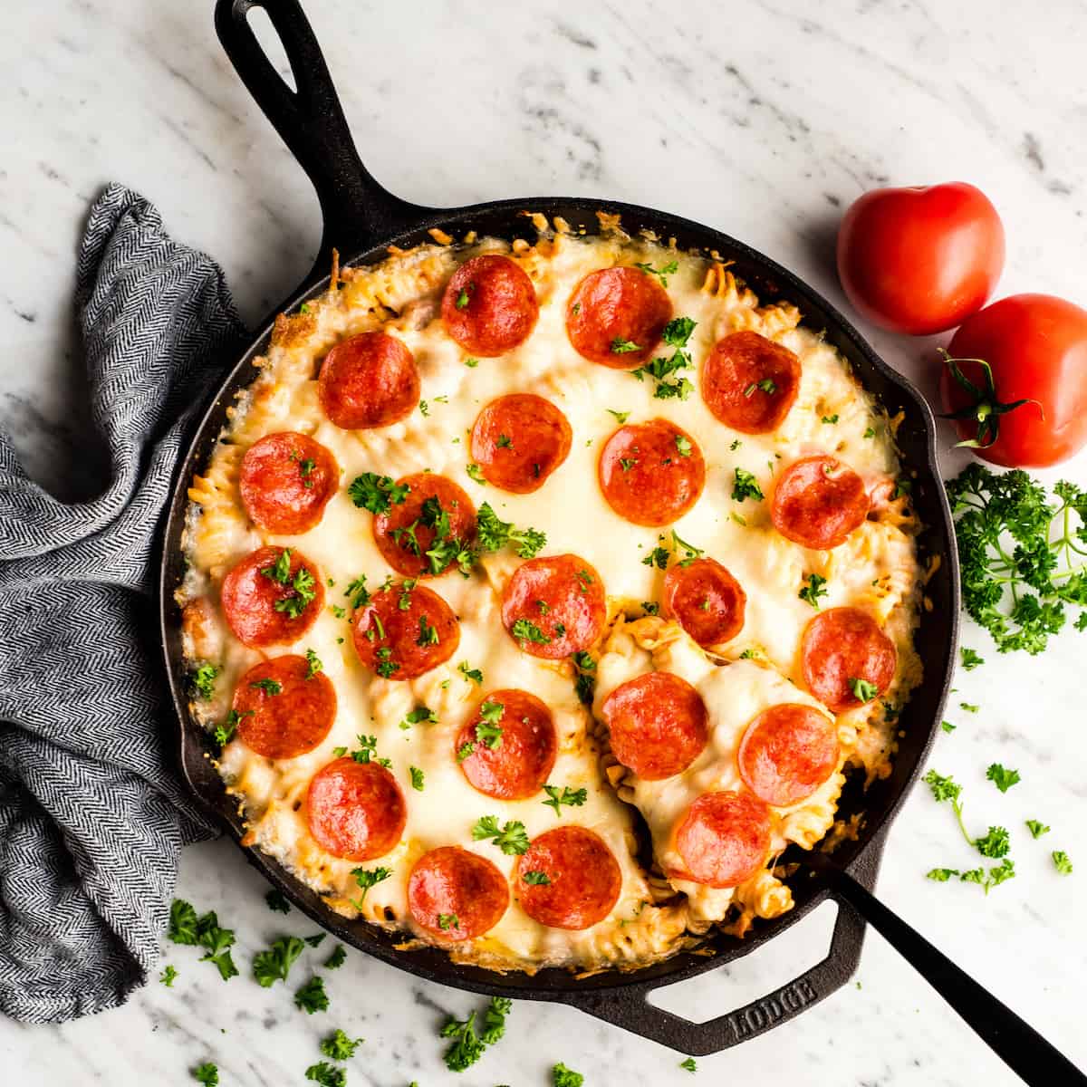 Overhead view of easy pizza casserole in a cast iron skillet
