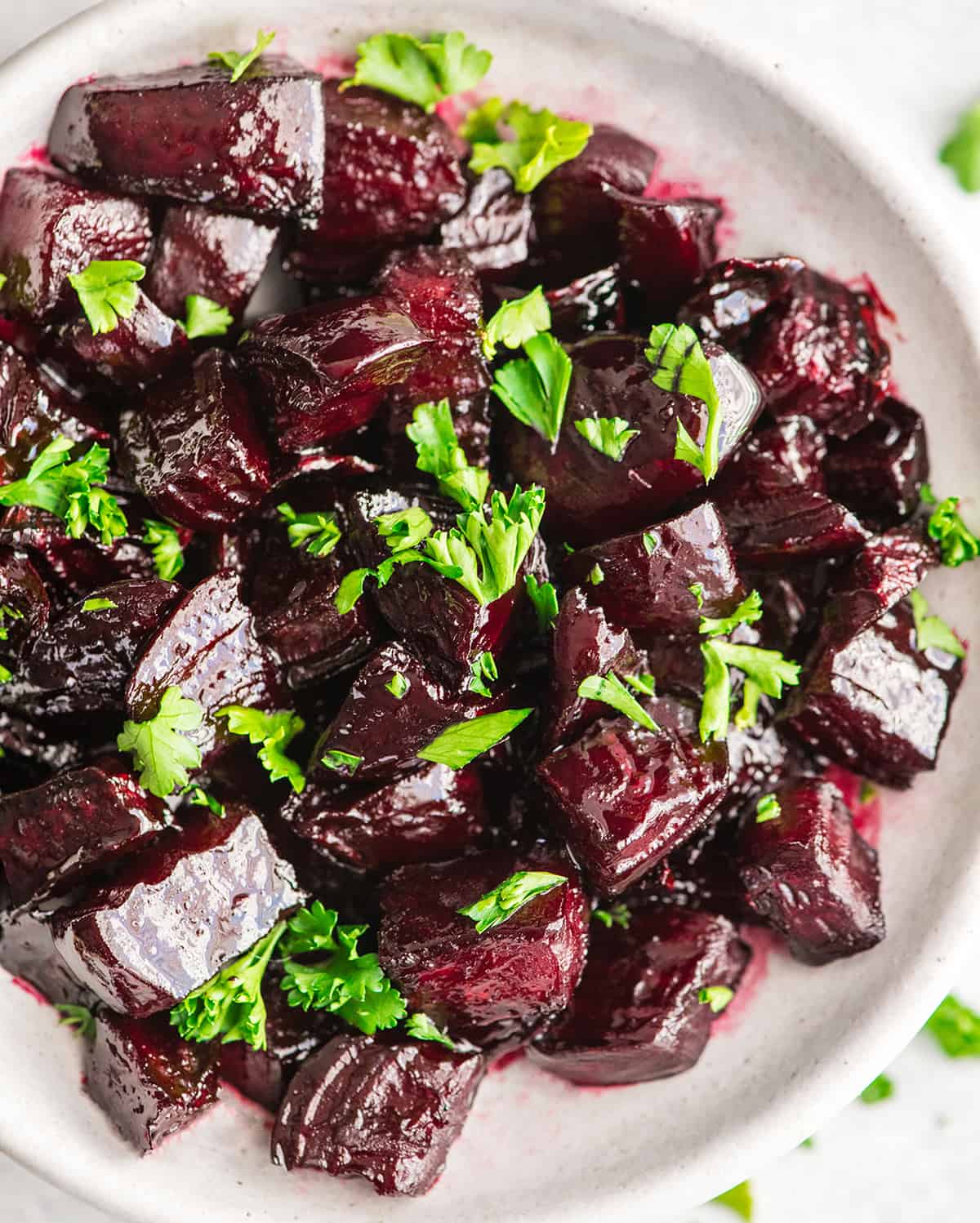 Roasted Beets in a bowl garnished with greens
