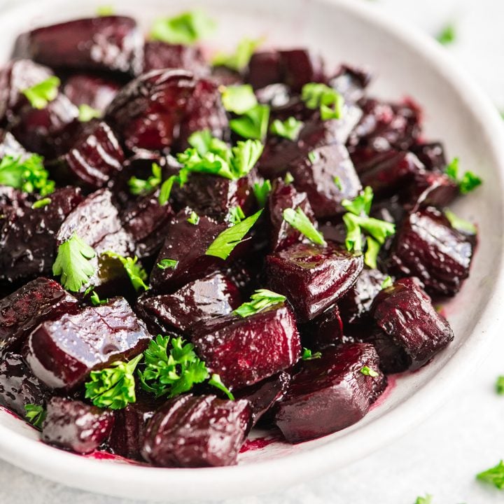 Roasted Beets in a bowl garnished with greens