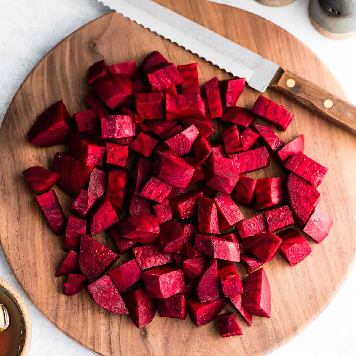 overhead photo fo beets chopped up on a cutting board