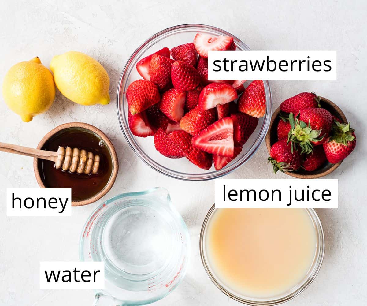 overhead photo of the labeled ingredients in this Homemade Strawberry Lemonade recipe