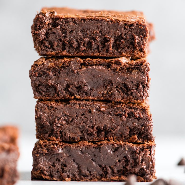 up close front view of a stack of 4 brownies made with the Brownie Recipe