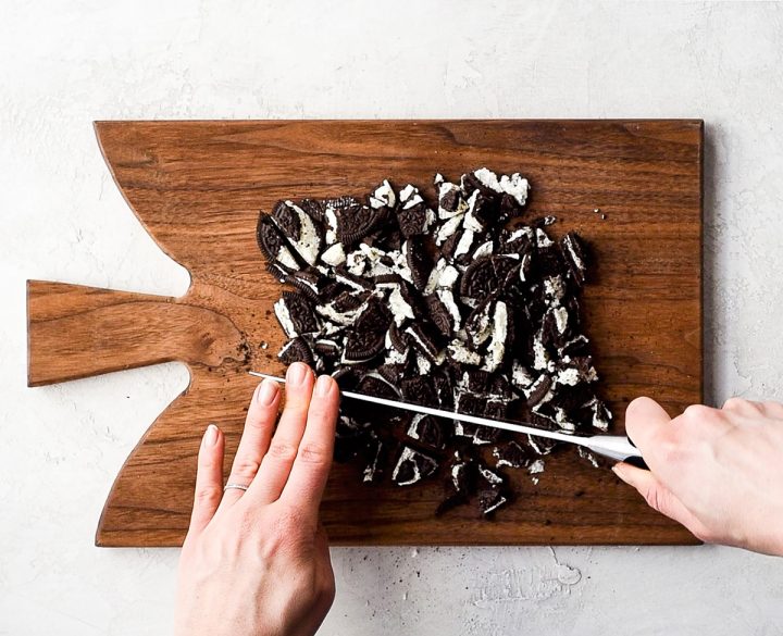 two photos showing how to make dirt cake -chopping oreos on a cutting board