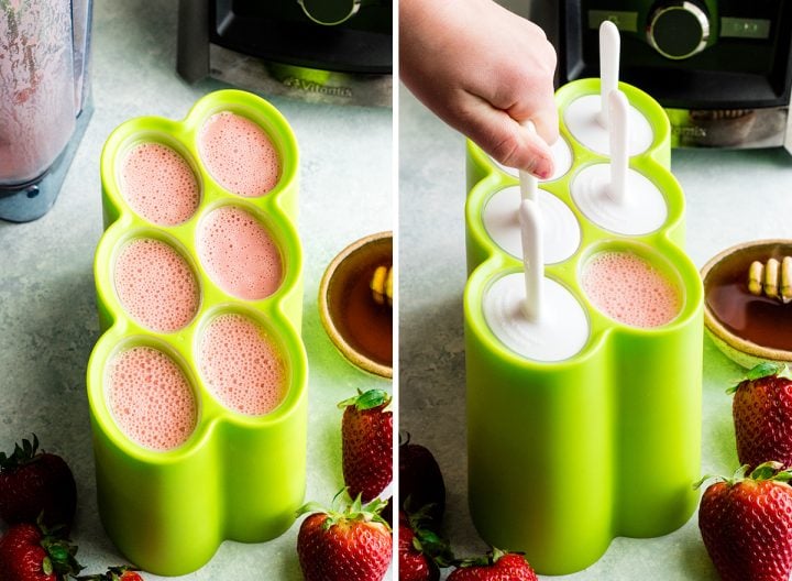 two photos with an overhead view of a green, six-well popsicle mold. The left photo shows the mold with all the wells filled with pink Homemade Fruit Popsicle mixture. The right photo shows a hand placing the lids and sticks onto the wells. 