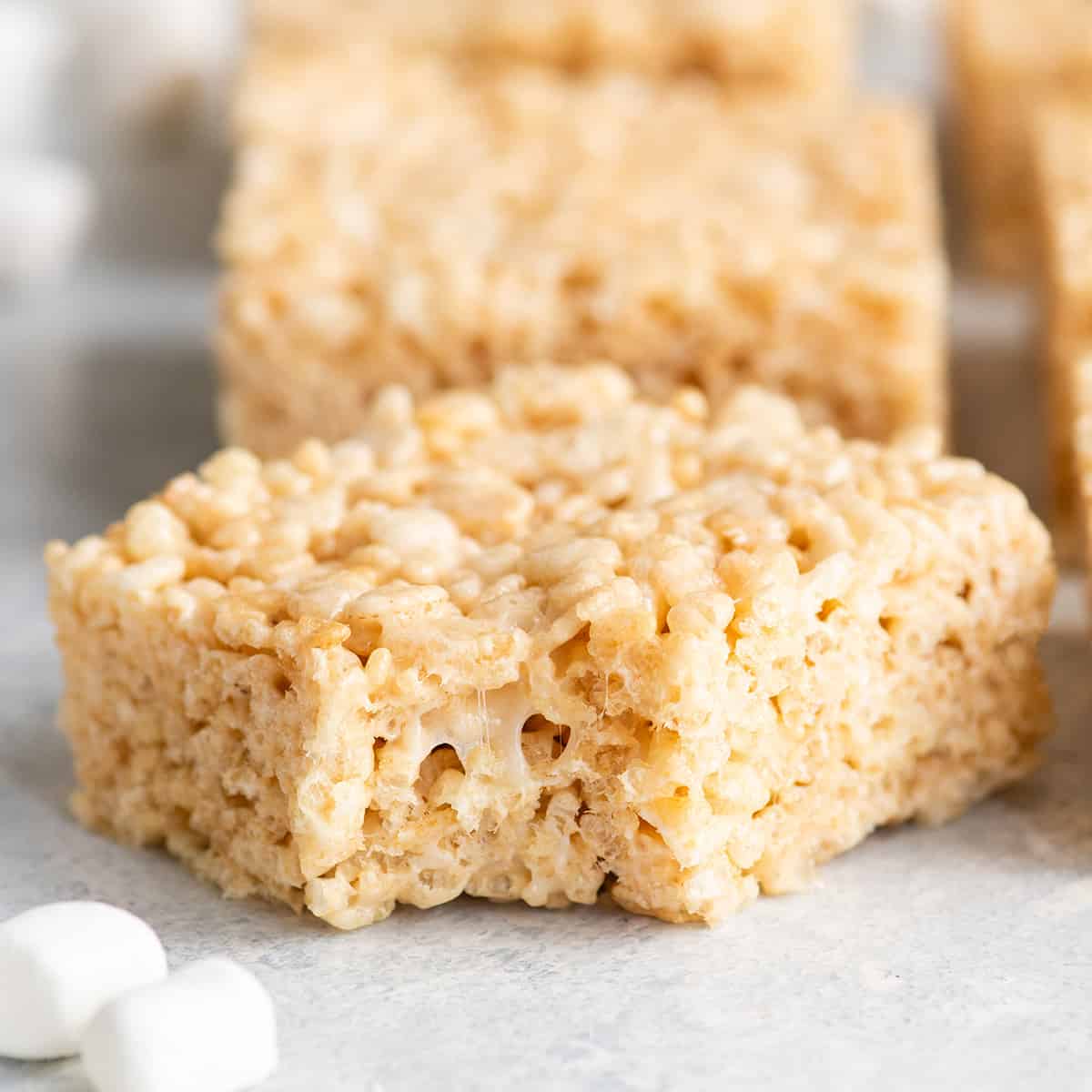 up close photo of a rice crispy treat with a bite taken out of it