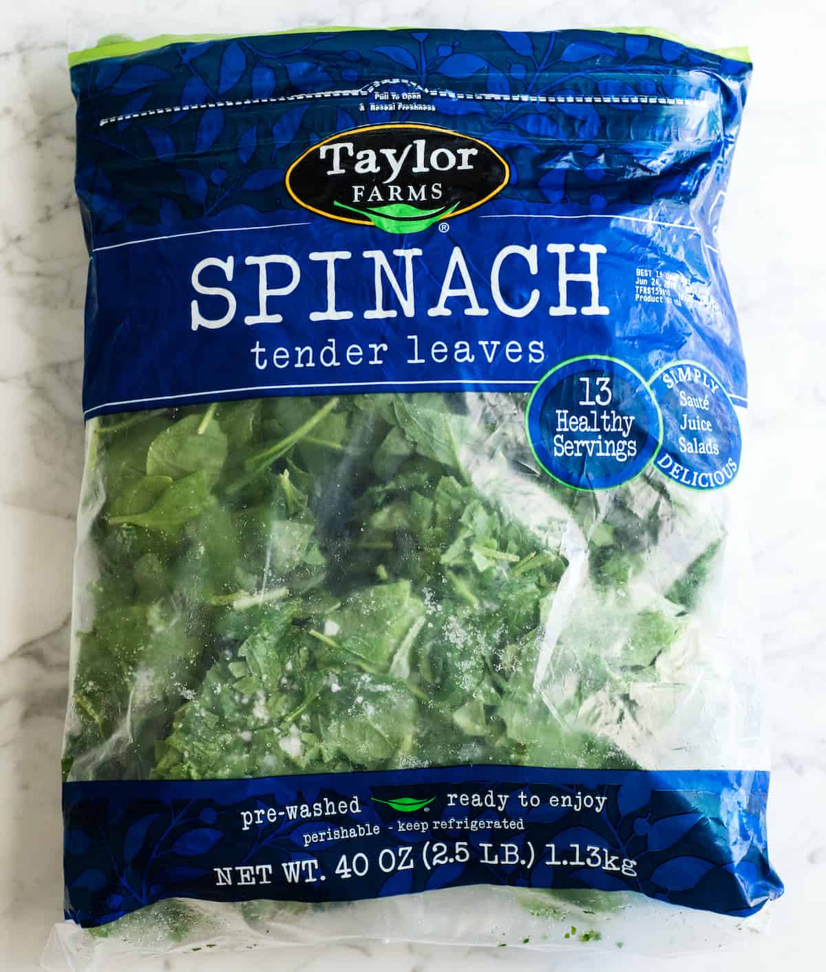 overhead view of a large (2.5 LB) bag of frozen spinach
