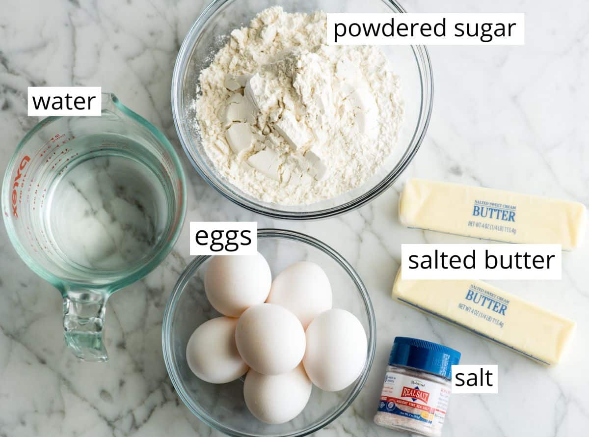 overhead photo of the labeled choux pastry ingredients in this eclairs recipe