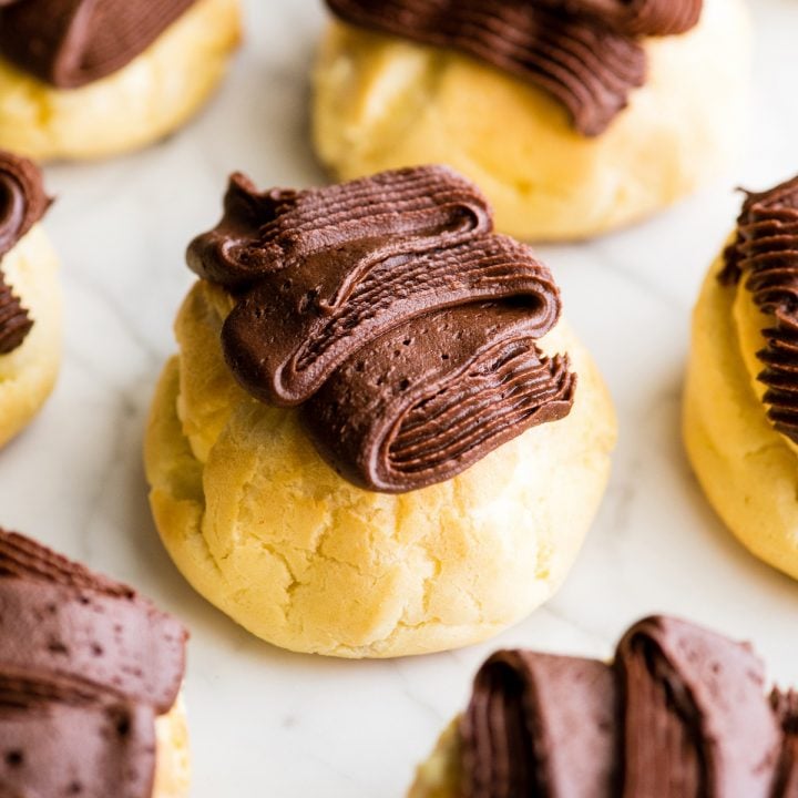 front view of homemade eclairs with chocolate frosting 