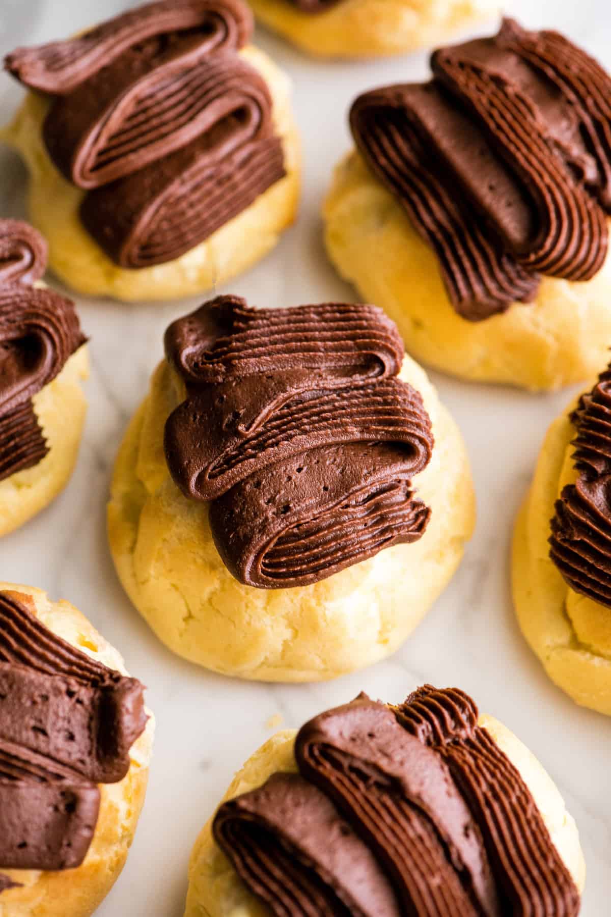 overhead view of 7 Homemade Eclairs with chocolate frosting