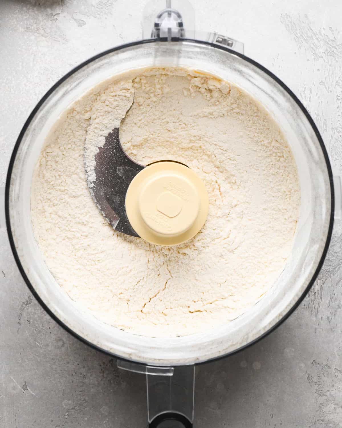 making pumpkin pie crust - flour salt and sugar in a food processor after mixing
