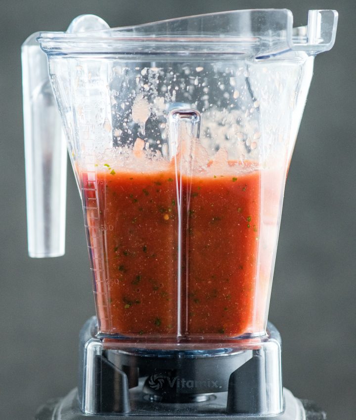 front view of homemade salsa in a blending container after being blended