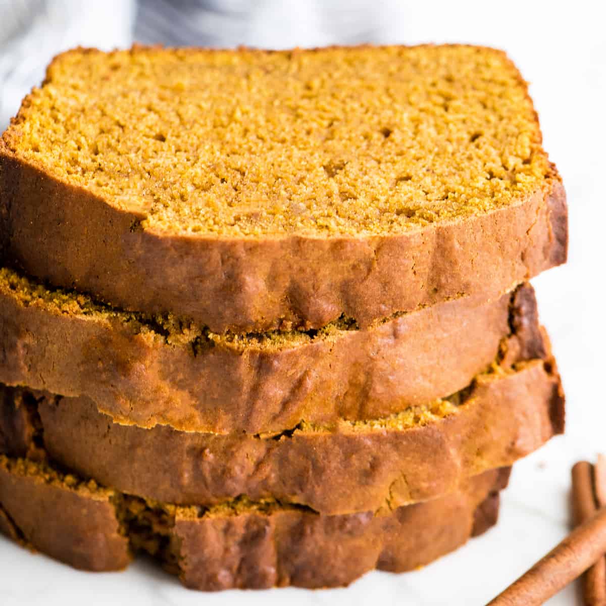stack of four pieces of pumpkin bread 