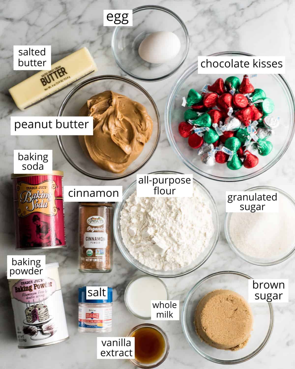 overhead view of the labeled ingredients in peanut butter blossom cookies recipe